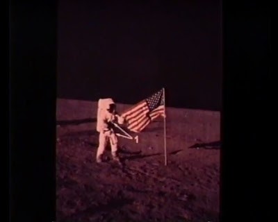 It should be Pete Conrad. Famous film, everyone thinks Pete builds flag as commanders do after landing